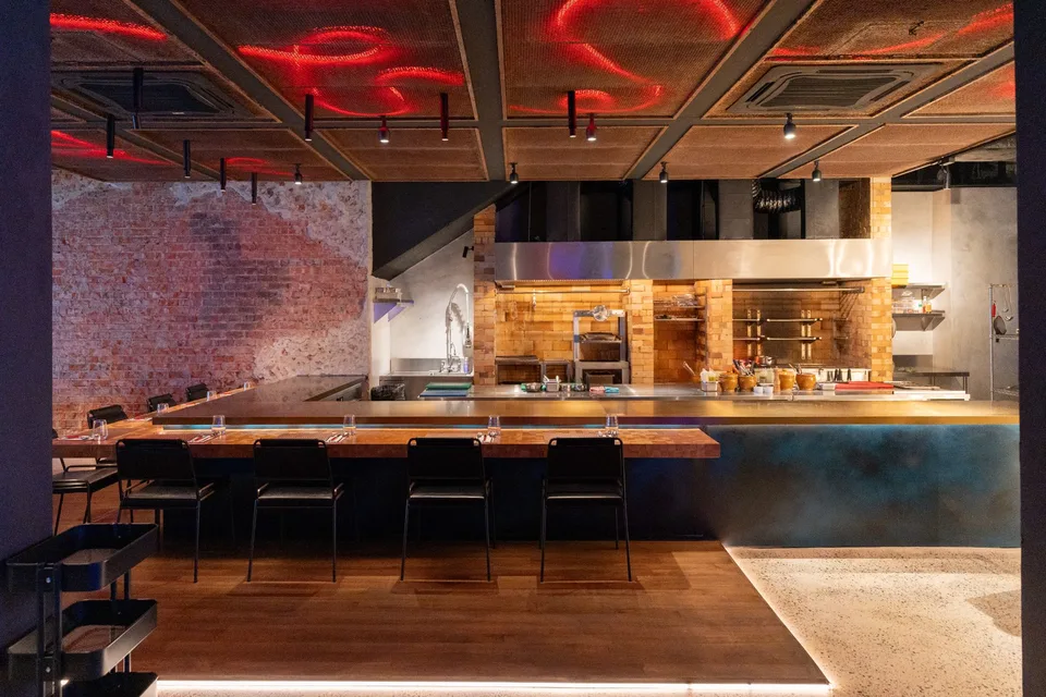 Coal Bukit Bintang: the chef’s counter and dry-aged duck. Photographs supplied with the restaurant brief.